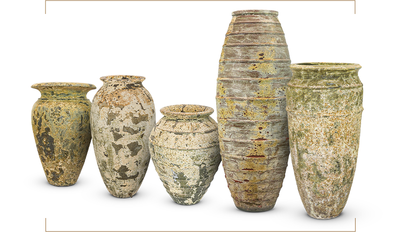 Five tall decorative vases in a row, each with a unique texture and finish.